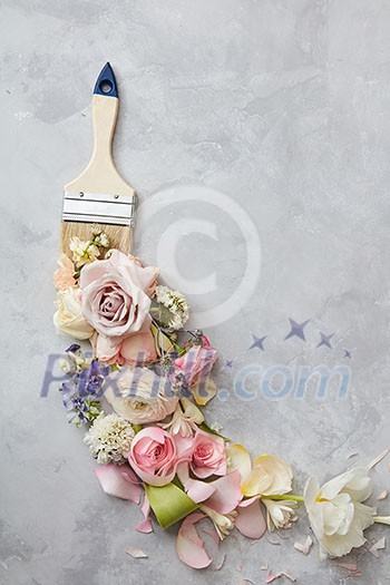 Top view of different flowers represented with bush over grey background. Blank space may be used for noting your ideas, emotions, etc. Top view of different flowers represented with bush over grey background. Blank space may be used for noting your ideas, emotions, etc.