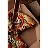 Hot Supreme Pizza with Pepperoni Peppers and mushrooms in the box, flat lay