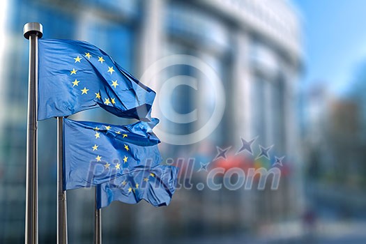 European union flag against parliament in Brussels, Belgium European union flag against parliament in Brussels, Belgium