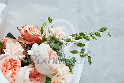 Closeup of bouquet of roses for giving as gift or present. Bouquet of roses represented over white background. Woman's Day concept. Closeup of bouquet of roses for giving as gift or present. Bouquet of roses represented over white background. Woman's Day concept.