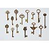 Ornamental medieval vintage keys with intricate forging, composed of fleur-de-lis elements, victorian leaf scrolls and heart shaped swirls.