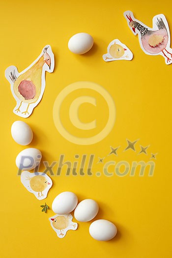 eggs on a yellow background with painted chickens as a frame