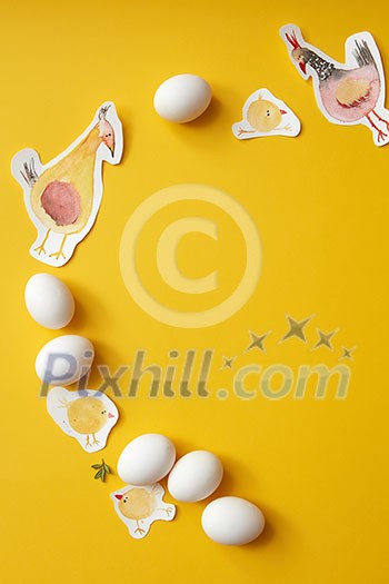 eggs on a yellow background with painted chickens as a frame eggs on a yellow background with painted chickens as a frame