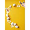 eggs on a yellow background with painted chickens as a frame