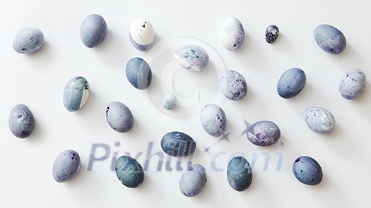 background of blue and white eggs on a white background