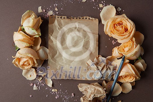 Blank craft paper with flowers around, copy space Blank craft paper with flowers around, copy space