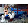 Portrait of a female researcher carrying out research in a chemistry lab (color toned image; shallow DOF)