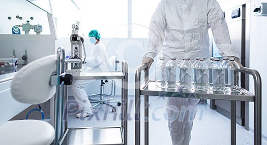 Flasks with liquids in a lab - Pharmaceutical industry factory and production laboratory (color toned image; shallow DOF) Flasks with liquids in a lab - Pharmaceutical industry factory and production laboratory (color toned image; shallow DOF)