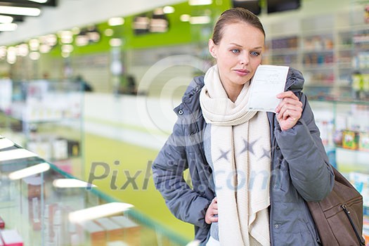 Young woman looking for the right pills in a modern pharmacy (shallow DOF; color toned image) Young woman looking for the right pills in a modern pharmacy (shallow DOF; color toned image)