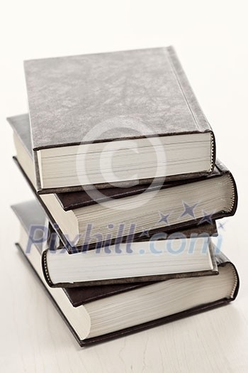 Stack of old hard cover leather bound books Stack of old hard cover leather bound books