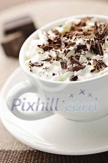 Cup of hot cocoa with shaved chocolate and whipped cream Cup of hot cocoa with shaved chocolate and whipped cream