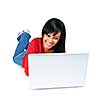 Smiling black woman typing on computer laying on floor