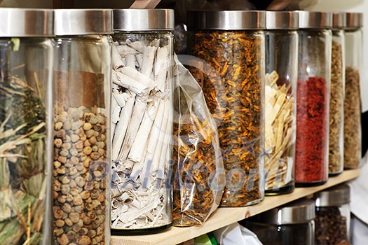 Traditional chinese medicine herbs and remedies in jars Traditional chinese medicine herbs and remedies in jars