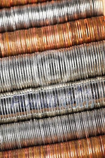Background of penny nickel dime and quarter stacked coins Background of penny nickel dime and quarter stacked coins