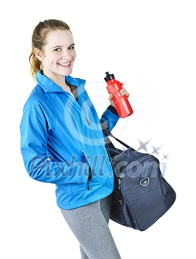 Smiling fit young woman with gym bag and water bottle ready for fitness exercise