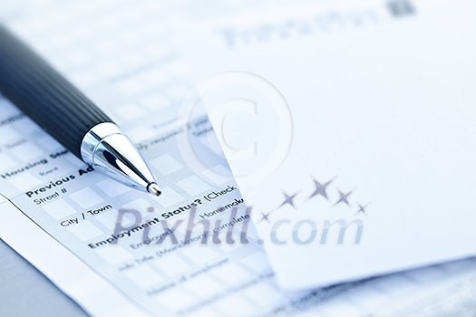 Blank credit application form with envelope and pen close up Blank credit application form with envelope and pen close up
