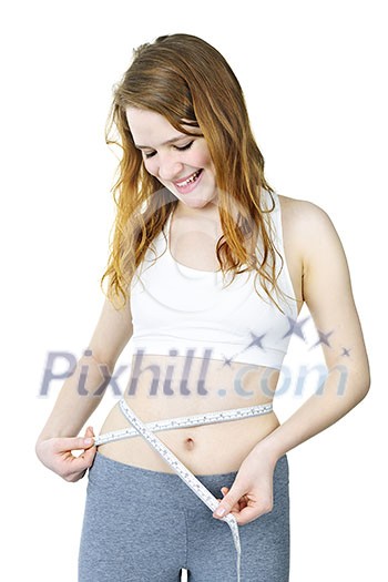 Happy fit young woman measuring waist with tape isolated on white Happy fit young woman measuring waist with tape isolated on white