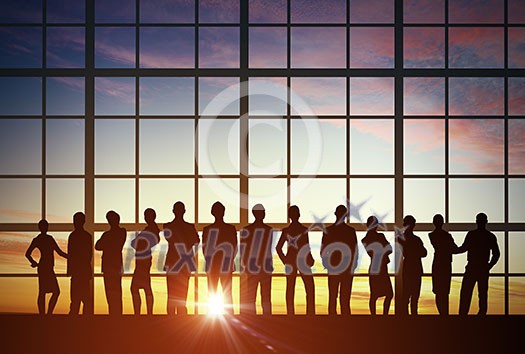 Silhouette of business people of different professions on sunset background Silhouette of business people of different professions on sunset background