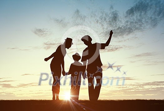 Silhouettes of happy family of three people mother father and child Silhouettes of happy family of three people mother father and child