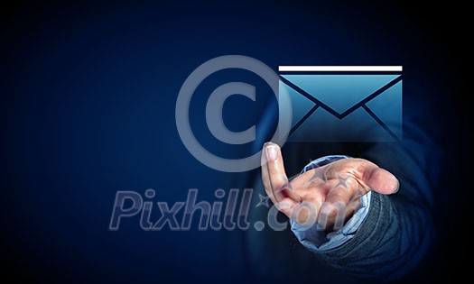 Close up of businessman palm holding email icon on dark background Close up of businessman palm holding email icon on dark background