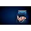 Close up of businessman palm holding email icon on dark background