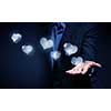Close up of businesswoman hand holding digital icon in palm