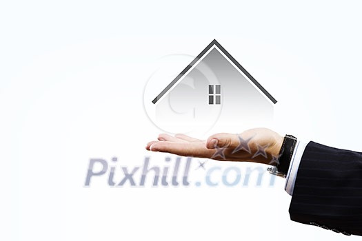 Close up of businessman holding real estate icon in palm on white background Close up of businessman holding real estate icon in palm on white background