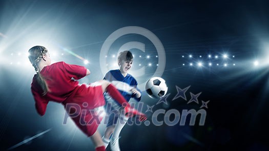 Kid boy and girl on soccer stadium fighting for ball Kid boy and girl on soccer stadium fighting for ball
