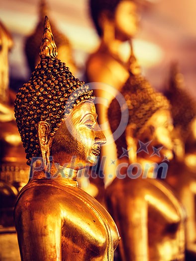 Vintage retro effect filtered hipster style image of golden Buddha statues in buddhist temple Wat Saket (The Golden Mount), Bangkok, Thailand Vintage retro effect filtered hipster style image of golden Buddha statues in buddhist temple Wat Saket (The Golden Mount), Bangkok, Thailand