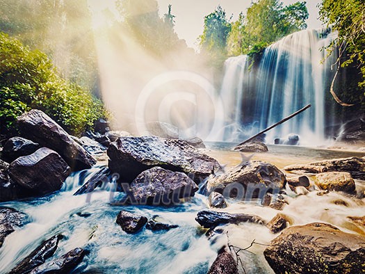 Vintage retro effect filtered hipster style image of tropical waterfall Phnom Kulen, Cambodia Vintage retro effect filtered hipster style image of tropical waterfall Phnom Kulen, Cambodia