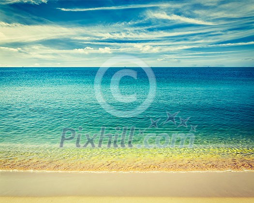 Resort beach holidays concept - vintage retro effect filtered hipster style image of tropical beach with clear water, wave surging on yellow sand and beautiful sky cloudscape, Sihanoukville, Cambodia Resort beach holidays concept - vintage retro effect filtered hipster style image of tropical beach with clear water, wave surging on yellow sand and beautiful sky cloudscape, Sihanoukville, Cambodia