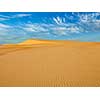 White sand dunes in desert on sunrise, Mui Ne, Vietnam.