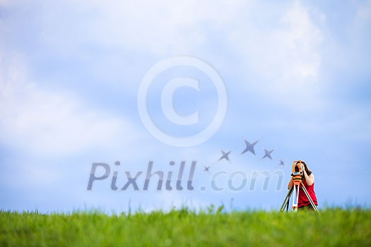 Young land surveyor at work Young land surveyor at work