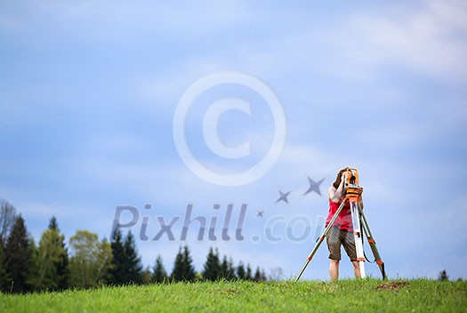 Young land surveyor at work Young land surveyor at work