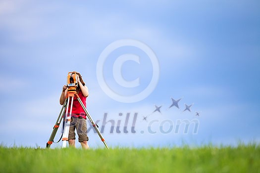 Young land surveyor at work Young land surveyor at work