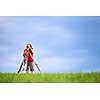 Young land surveyor at work