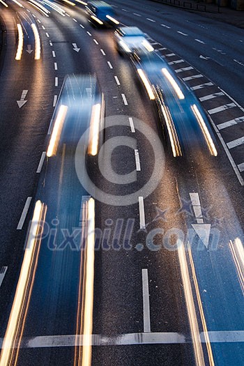 Motion blurred city road traffic (color toned image) Motion blurred city road traffic (color toned image)