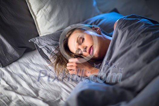 Beautiful young woman sleeping in bed (colour toned image; shallow DOF) Beautiful young woman sleeping in bed (colour toned image; shallow DOF)