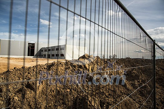 Construction site with a fence around it