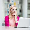 Pretty young college student in a library (shallow DOF; color toned image)