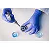 Hands of a researcher carrying out scientific research in a lab