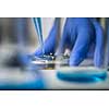 Hands of a researcher carrying out scientific research in a lab