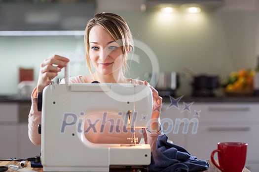 Beautiful young woman sewing clothes with sewing machine (color toned image; shallow DOF) Beautiful young woman sewing clothes with sewing machine (color toned image; shallow DOF)