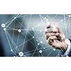 Businessman hand drawing digital connection lines on virtual screen