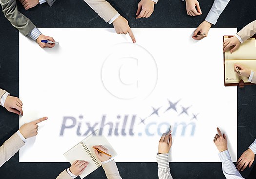Top view of people hands drawing business teamwork strategy Top view of people hands drawing business teamwork strategy