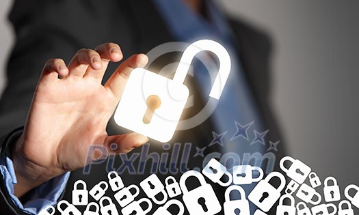 Female hand taking glowing lock with fingers Female hand taking glowing lock with fingers