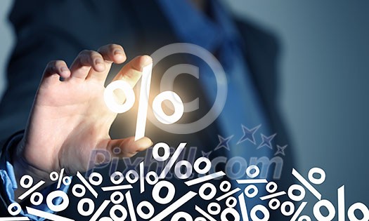 Close up of businessperson taking virtual percent icon with fingers Close up of businessperson taking virtual percent icon with fingers