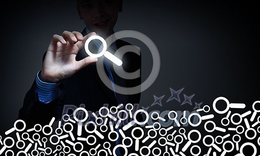 Businessman on dark background taking with fingers search icon Businessman on dark background taking with fingers search icon