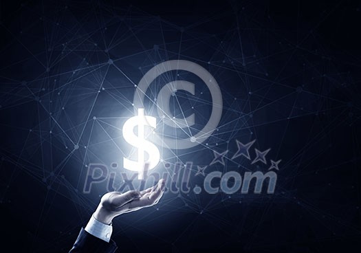 Businessman hands on dark background holding glowing dollar sign Businessman hands on dark background holding glowing dollar sign