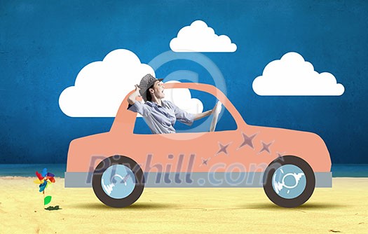 Young humorous woman driving drawn funny car Young humorous woman driving drawn funny car